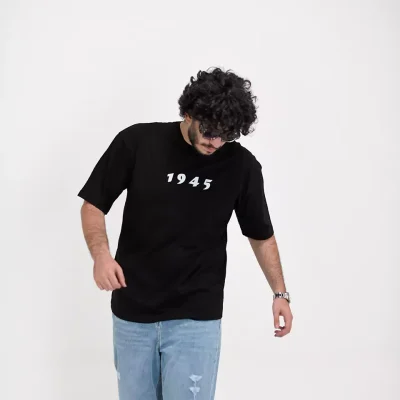 Model wearing a black 1945 t-shirt for men - new summer collection