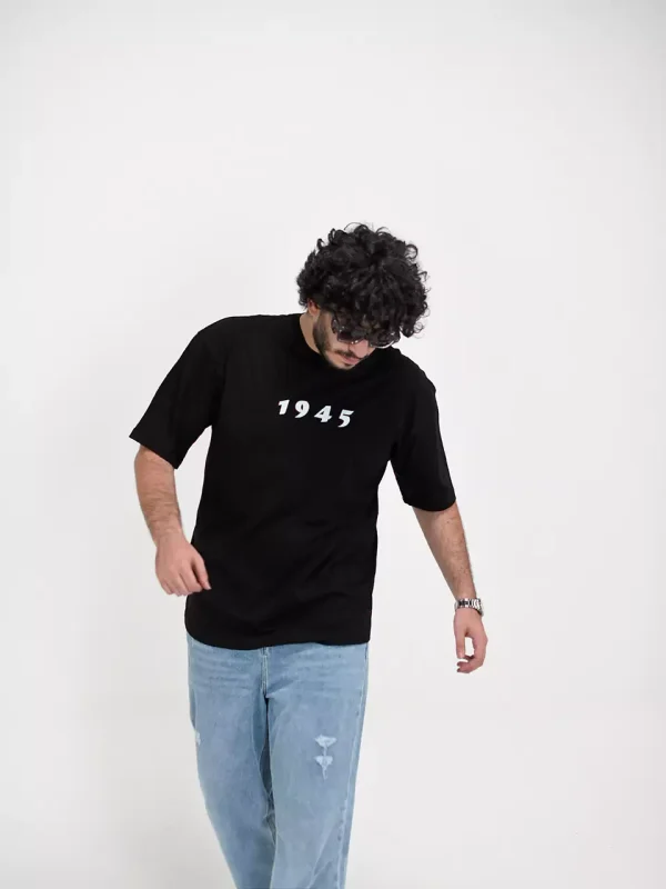 Model wearing a black 1945 t-shirt for men - new summer collection
