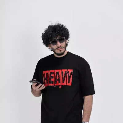 Model wearing a black heavy t-shirt for men - new summer collection