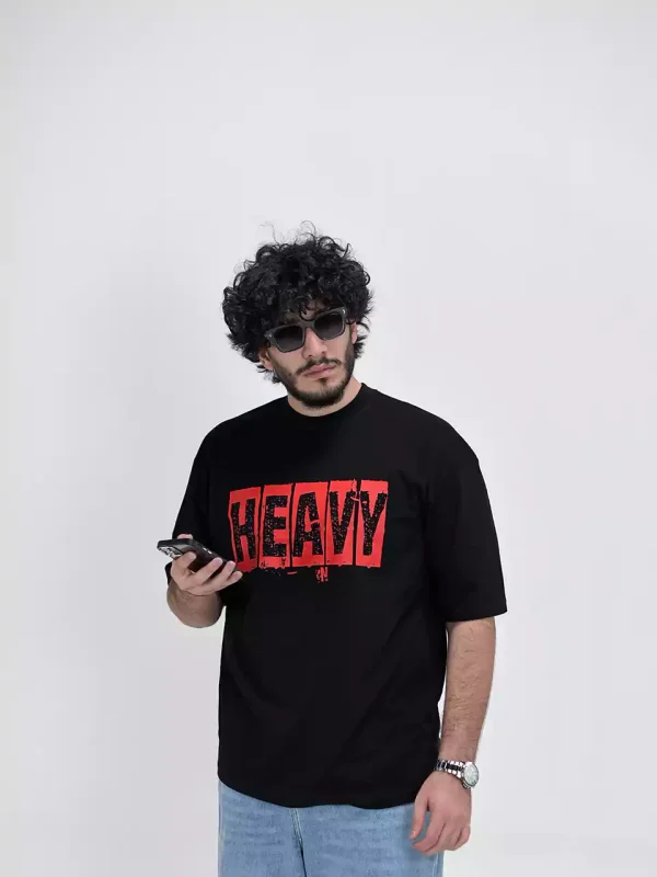 Model wearing a black heavy t-shirt for men - new summer collection
