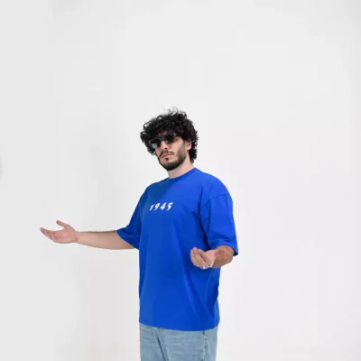 Model wearing a blue 1945 t-shirt for men - new summer collection