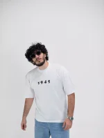 Model wearing a white 1945 t-shirt for men - new summer collection