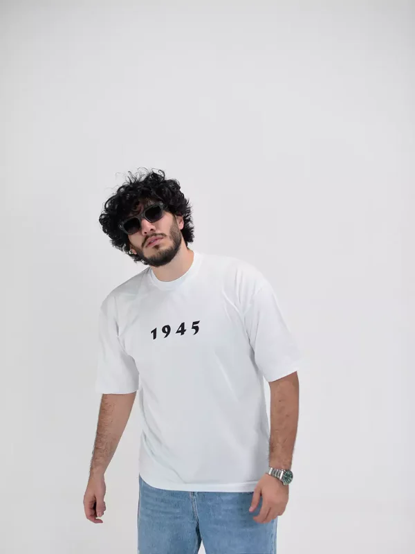 Model wearing a white 1945 t-shirt for men - new summer collection