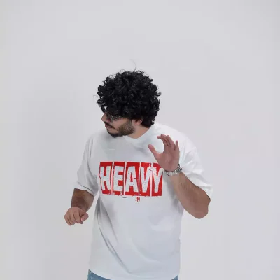 Model wearing a white heavy t-shirt for men - new summer collection