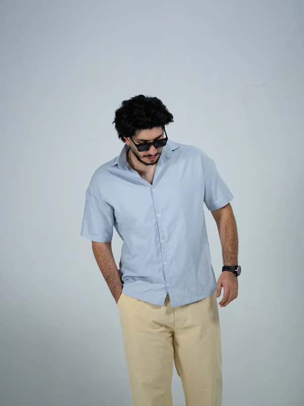 Model wearing a sky blue Linen Shirt for men - new summer collection