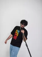 Model wearing a black awesome t-shirt for men - new summer collection