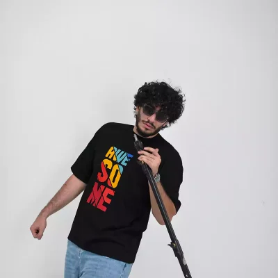 Model wearing a black awesome t-shirt for men - new summer collection