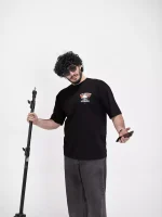 Model wearing a black journey t-shirt for men - new summer collection