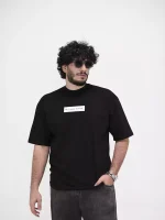 Model wearing a black nice human t-shirt for men - new summer collection