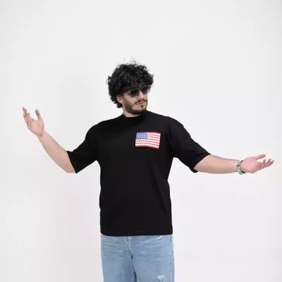 Model wearing a black NEW YORK t-shirt for men - new summer collection