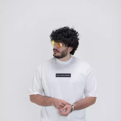Model wearing a white nice human t-shirt for men - new summer collection