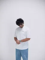 Model wearing a white represent t-shirt for men - new summer collection