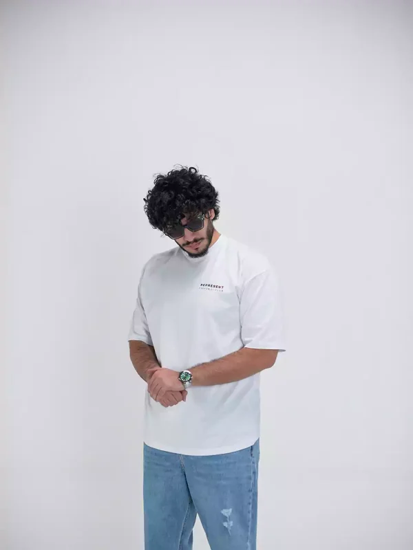 Model wearing a white represent t-shirt for men - new summer collection